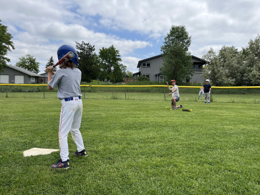Player practicing batting on the field